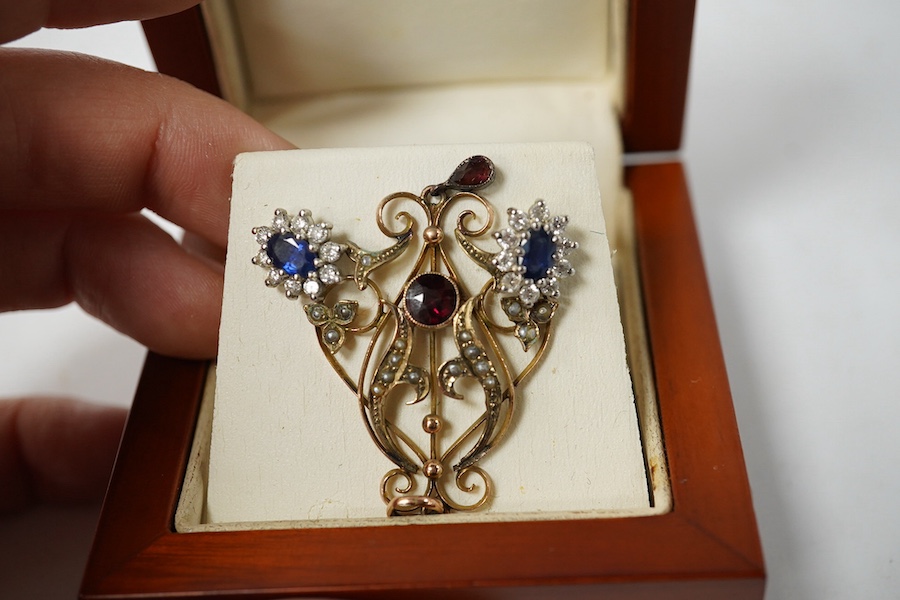 A pair of sapphire and diamond cluster earrings, length 2.2cm each, post fittings, and a gold, garnet and seed pearl pendant, length 4.7cm, stamped 9CT. Condition - good